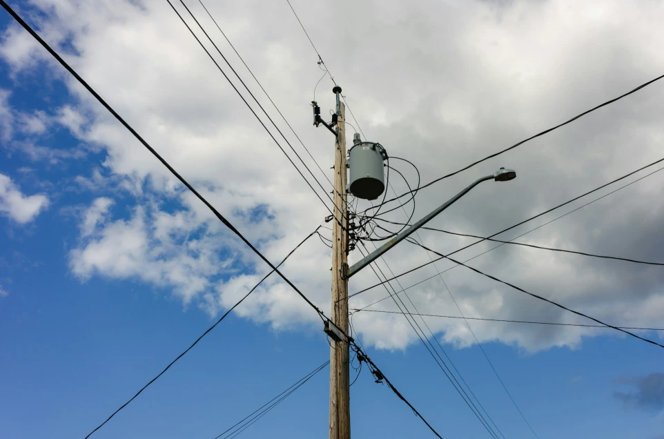 a telephone pole with a sky background